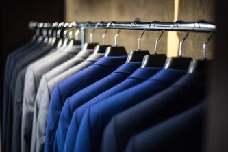 Dry cleaning garments on a rack